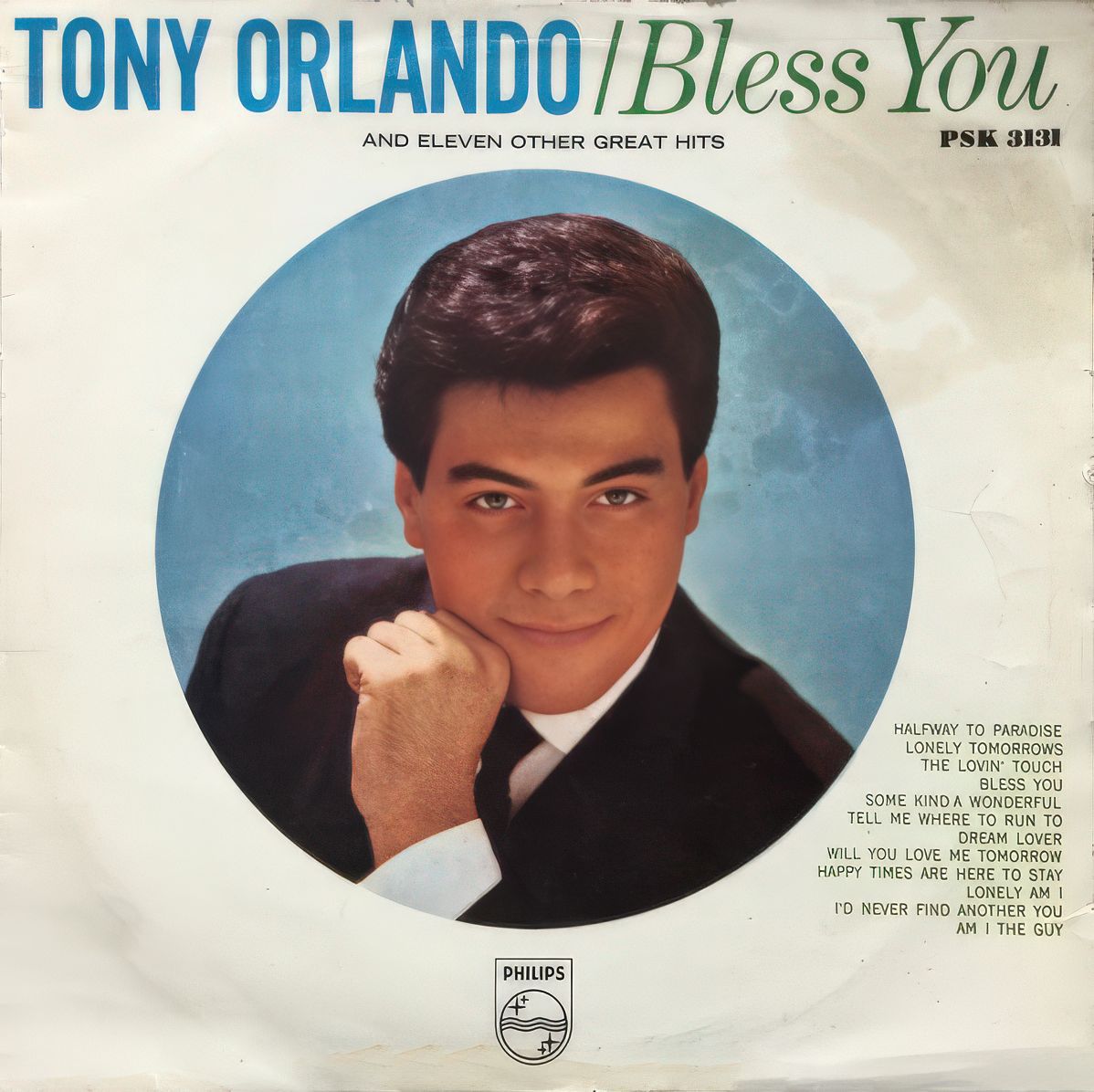 Album cover featuring Tony Orlando's image with a blue background and a list of songs on the right side.